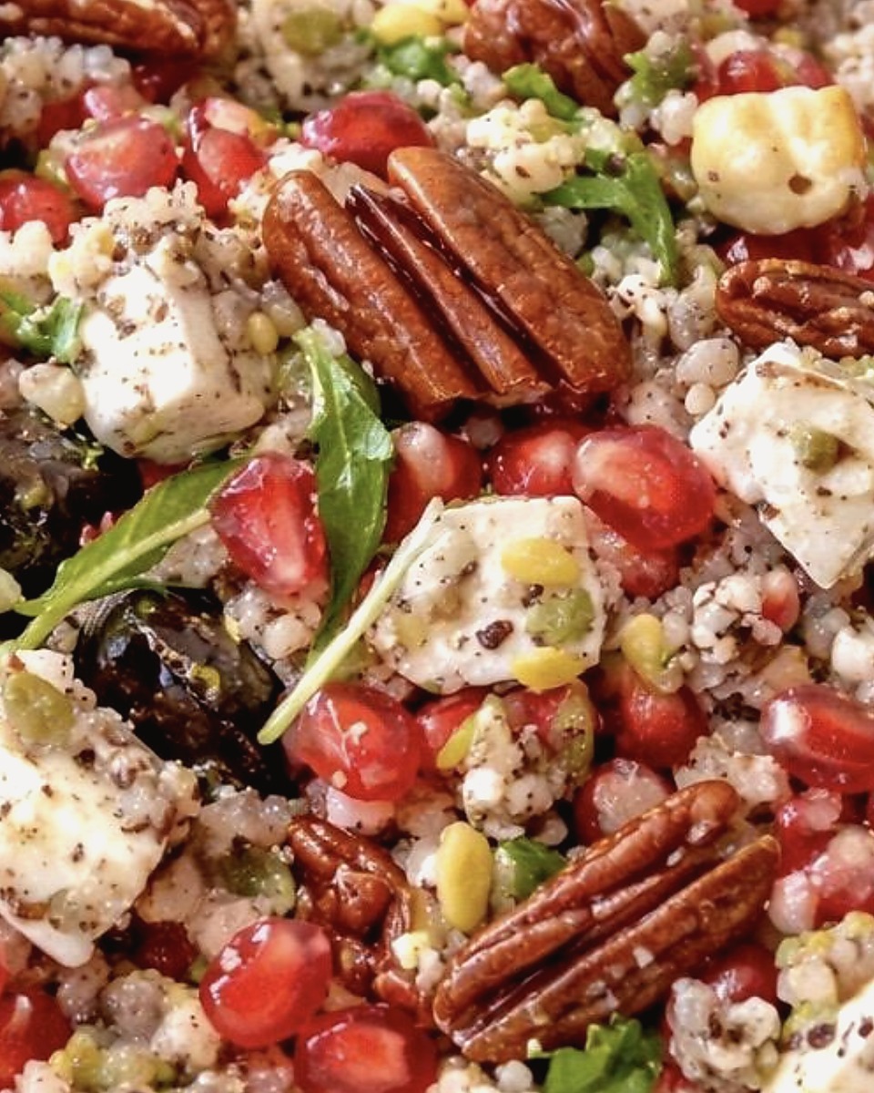 Polished Protein Drop salad with pomegranate, feta, herbs, and pecans